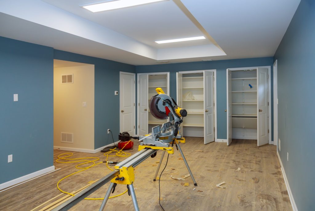 Cutting and nailing shoe molding using nail air gun and circular saw construction building industry